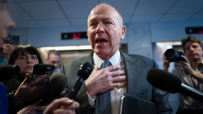 Boeing CEO Dave Calhoun speaks briefly with reporters after a meeting in the office of Sen. Mark Warner, D-Va., at the Capitol in Washington, Wednesday, Jan. 24, 2024.