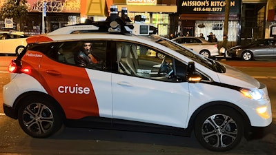 Associated Press reporter Michael Liedtke sits in the back of a Cruise driverless taxi that picked him up in San Francisco's Mission District, Feb. 15, 2023.