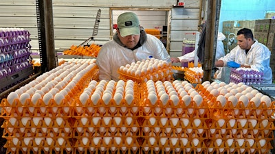 A worker moves crates of eggs at the Sunrise Farms processing plant in Petaluma, Calif., on Thursday, Jan. 11, 2024, which has seen an outbreak of avian flu in recent weeks.