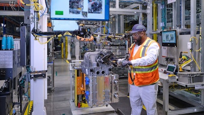 An employee assembles a fuel cell system in the module final assembly at Fuel Cell System Manufacturing LLC, GM and Honda’s fuel cell joint venture in Brownstown, Michigan.