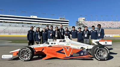 The Cavalier Autonomous Racing team stands behind their driverless race car.