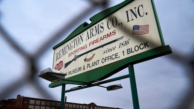 A sign for Remington Arms Co. is displayed in front of their compound in Ilion, N.Y., Thursday, Feb. 1, 2024. The nation’s oldest gun-maker is consolidating operations in Georgia and recently announced plans to shutter the Ilion factory in early March.