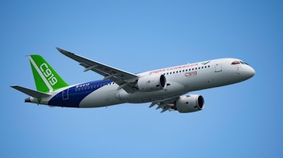 A China's Comac C919 aircraft performs during first day of Singapore Airshow in Singapore, Tuesday, Feb. 20, 2024.