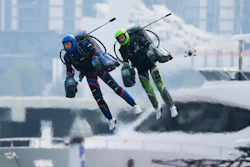 Jet suit pilots race in Dubai, United Arab Emirates, Wednesday, Feb. 28, 2024. Dubai on Wednesday hosted what it called its first-ever jet suit race. Racers zipped along a route with the skyscrapers of Dubai Marina looming behind them, controlling the jet engines on their hands and their backs.