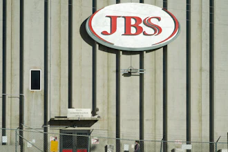 A worker heads into the JBS meatpacking plant in Greeley, Colo., Oct. 12, 2020.