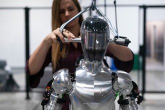 AI engineer Jenna Reher works on humanoid robot Figure 01 at Figure AI's test facility in Sunnyvale, Calif., Oct. 3, 2023.