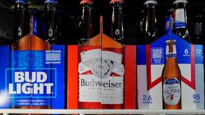 Six-packs of Bud Light, Budweiser and Michelob Ultra are displayed at a liquor store, Wednesday, Feb. 28, 2024, in Fairfield, Calif.