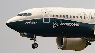 A Boeing 737 Max jet prepares to land at Boeing Field following a test flight in Seattle, Sept. 30, 2020.