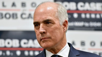 Sen. Bob Casey, D-Pa., listens to a speaker during an event at AFSCME Council 13 offices, March 14, 2024, in Harrisburg, Pa.
