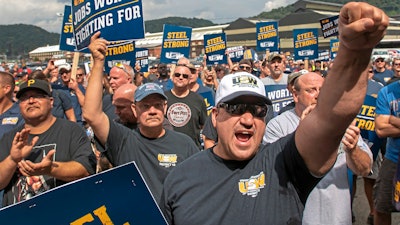 Tom Duffy of Clairton raises his fist as hundreds of United Steelworkers rally and march on Thursday, Aug. 30, 2018, in Clairton, Pa.