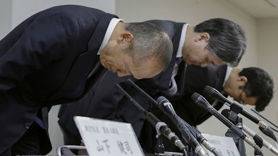 Akihiro Kobayashi, President of Kobayashi Pharmaceutical Co., left, bows during a press conference in Osaka, on March 22, 2024. Health supplement products believed to have caused a few deaths and sickened more than a hundred people have been ordered taken off store shelves in Japan. The products from Kobayashi Pharmaceutical, billed as helping lower cholesterol, contained an ingredient called “benikoji,” a red species of mold.