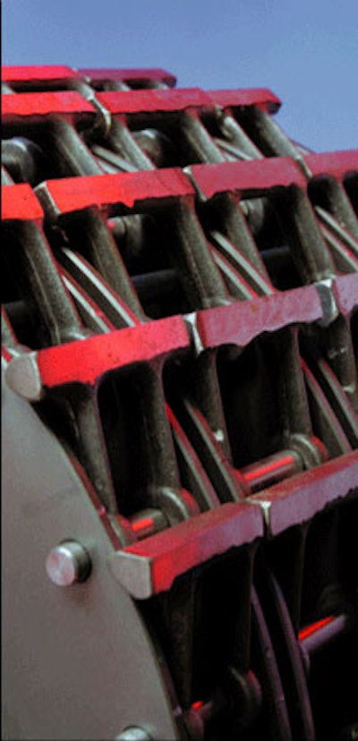 The material is impacted by the hammers and is thereby pulverized and expelled through a screen in the bottom of the mill.