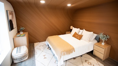 A bed sits inside the University of Maine's first 3D printed home on Oct. 12, 2023, in Orono, Maine.