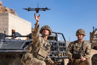 In this photo from the Defense Visual Information Distribution Service, British soldiers launch a drone during Project Convergence exercises at Fort Irwin, Calif., on Nov. 4, 2022.
