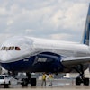 Boeing employees walk the new Boeing 787-10 Dreamliner down towards the delivery ramp area at the company's facility after conducting its first test flight at Charleston International Airport, Friday, March 31, 2017, in North Charleston, S.C.