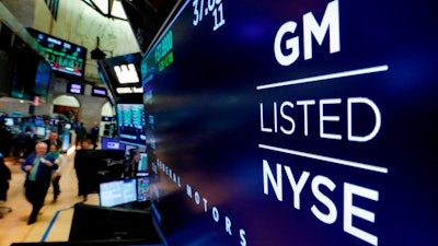 In this April 23, 2018, file photo, the logo for General Motors appears above a trading post on the floor of the New York Stock Exchange.