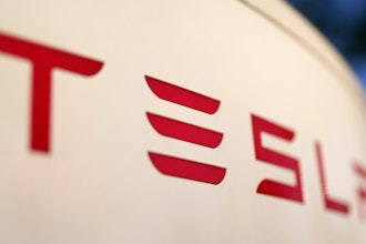 The logo for the Tesla Supercharger station is seen in Buford, Ga, April 22, 2021.