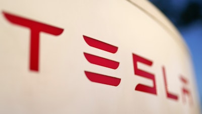The logo for the Tesla Supercharger station is seen in Buford, Ga, April 22, 2021.