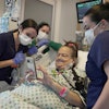 Lisa Pisano looks at photos of her dog after her surgeries at NYU Langone Health in New York on Monday, April 22, 2024. Doctors transplanted a pig kidney into Pisano, who was near death, part of a dramatic pair of surgeries that also included a fix for her failing heart.