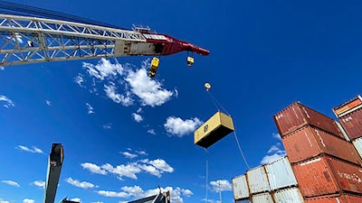 In this photo provided by the Key Bridge Response 2024 Unified Command, response crews begin removing shipping containers from the deck of the cargo ship Dali using a floating crane barge at the site of the Francis Scott Key Bridge, Sunday, April 7, 2024, in Baltimore.