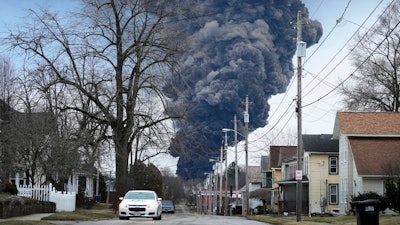 A black plume rises over East Palestine, Ohio, as a result of a controlled detonation of a portion of the derailed Norfolk Southern trains Monday, Feb. 6, 2023.