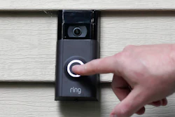 A person pushes the doorbell on his Ring doorbell camera, July 16, 2019, at his home in Wolcott, Conn.