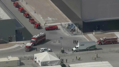 This image made from video provided by ABC15 shows emergency vehicles as they respond to the TSMC semiconductor plant under construction in Phoenix, Wednesday, May 15, 2024, after a worker was fatally injured when a tank holding waste material depressurized. He was struck and thrown over 20 feet.