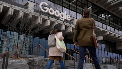 People arrive at the recently opened Google building in New York, Feb. 26, 2024.