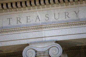 This June 6, 2019, file photo shows the U.S. Treasury Department building at dusk in Washington.
