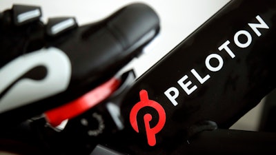 This Nov. 19, 2019 file photo shows the logo on a Peloton bike in San Francisco.