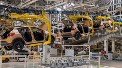 Cars are placed on a production line inside a Renault factory outside of Tangier, Morocco, Monday, April 29, 2024.