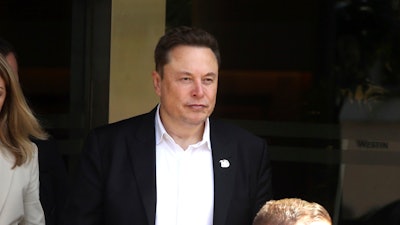 Elon Musk, center, arrives for the 10th World Water Forum in Nusa Dua, Bali, Indonesia on Monday, May 20, 2024.