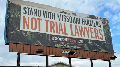 A billboard supporting legislation that would provide legal protection to manufacturers of pesticides such as Bayer's popular weedkiller Roundup, is shown in Jefferson City, Mo., on May 13, 2024.