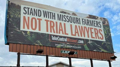 A billboard supporting legislation that would provide legal protection to manufacturers of pesticides such as Bayer's popular weedkiller Roundup, is shown in Jefferson City, Mo., on May 13, 2024.
