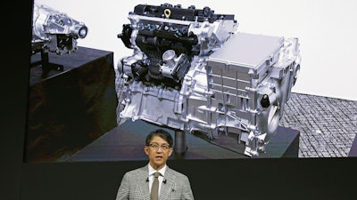 Koji Sato, chief executive of Toyota Motor Corp., speaks during a news conference in Tokyo, Tuesday, May 28, 2024. “An engine reborn.” That's how Japanese automaker Toyota introduced plans for a new lean compact motor that will cast a futuristic spin on the traditional internal combustion engine.