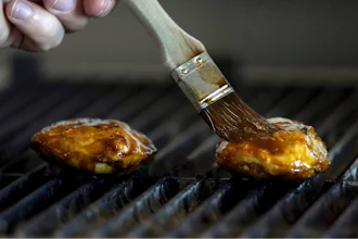 Chef Zach Tyndall prepares Good Meat's cultivated chicken at the Eat Just office in Alameda, Calif., June 14, 2023.