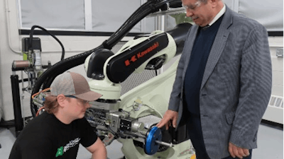 Professor Emad Tanbour works with Tyler Werth, a mechanical engineering student, in the Coherix 3D computer-vision and virtual-reality lab at Eastern Michigan University in Ypsilanti, Michigan.