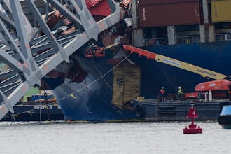 Workers remove wreckage of the collapsed Francis Scott Key Bridge, Thursday, April 25, 2024, in Baltimore.