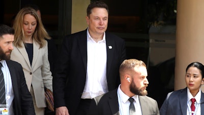 Elon Musk, center, arrives for the 10th World Water Forum in Nusa Dua, Bali, Indonesia on Monday, May 20, 2024.