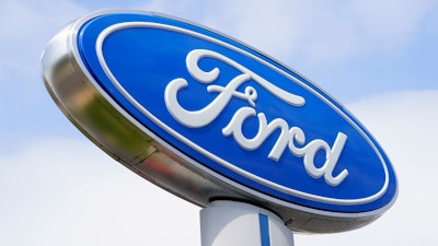 A Ford sign is shown at a dealership in Springfield, Pa., Tuesday, April 26, 2022.