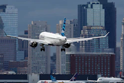 A plane lands at Logan International Airport, Thursday, Jan. 26, 2023, in Boston.