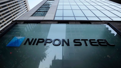 Nippon Steel Corporation's logo is displayed on a sign outside its headquarters in Tokyo on Nov. 26, 2021.