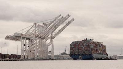 Tugboats escort the cargo ship Dali after it was refloated in Baltimore, May 20, 2024.