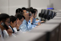 In this photo released by Xinhua News Agency, technical personnel work at the Beijing Aerospace Control Center (BACC) in Beijing, Sunday, June 2, 2024. A Chinese spacecraft landed on the far side of the moon Sunday to collect soil and rock samples that could provide insights into differences between the less-explored region and the better-known near side.