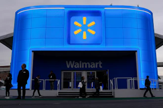 People walk by the Walmart booth during the CES tech show Tuesday, Jan. 9, 2024, in Las Vegas.