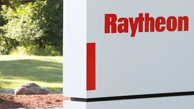 A sign stands at the road leading to the Raytheon facility in Marlborough, Mass., on June 10, 2019.