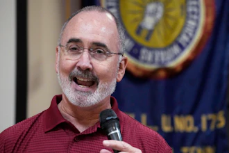 United Auto Workers President Shawn Fain speaks to Volkswagen auto workers, April 19, 2024, in Chattanooga, Tenn., after workers at a VW factory voted to join the UAW.