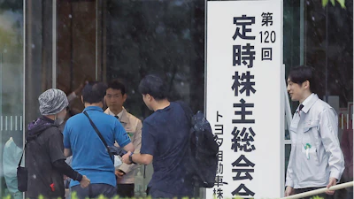 Toyota shareholders arrive for a meeting in Toyota, Aichi prefecture, central Japan,