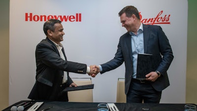 Honeywell Process Solutions President Pramesh Maheshwari, left, and Danfoss Power Electronics and Drives President Mika Kulju.