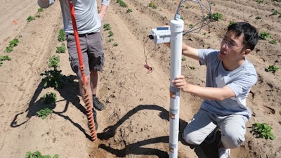 Placement of a sensing rod, which has multifunctional sensing stickers positioned to enable multi-depth measurements.